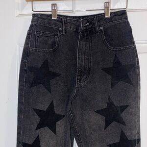 Nasty gal women’s size 2 black denim and stars, flare, legged jeans /raw hem
